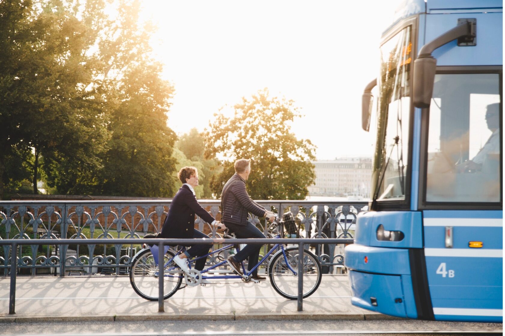 Public Transportation: image of two Bikers and a blue public bus